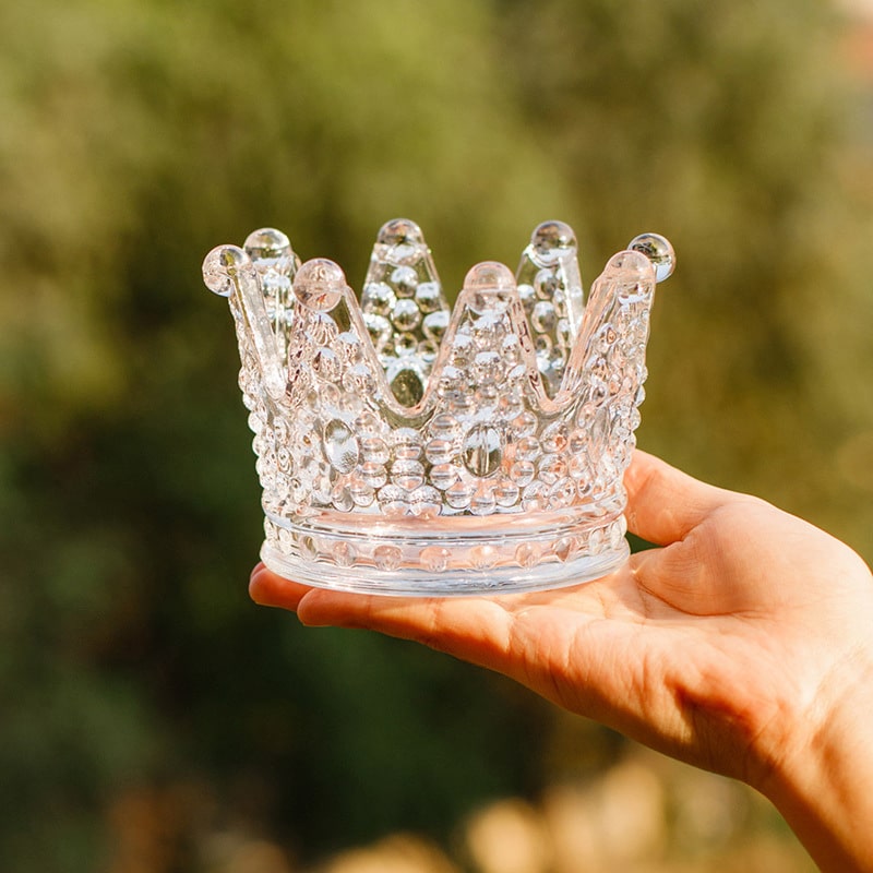 Hand holding the Crown Ashtray & Candle Holder