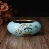 blue ceramic ashtray without lid with flower paintings