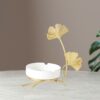 Elegant White Ashtray With Golden Leaf Stand On Table