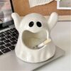 Ghost Ashtray With Cigarette On A Notebook Computer