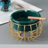 green ceramic ashtray with golden frame