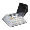 Pyramid Ashtray with open lid and cigarette in silver color